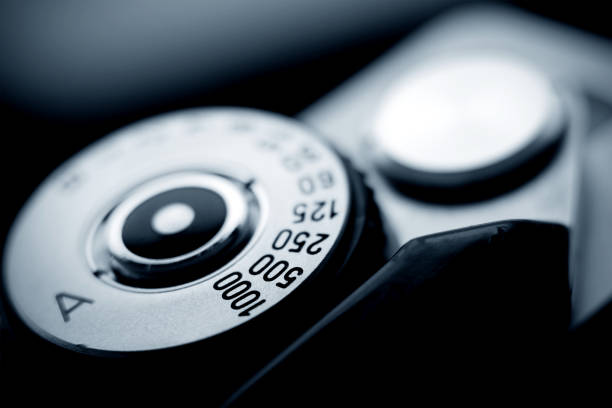 Analog film camera top view with a shutter dial set to aperture priority. Shutter speed dial.