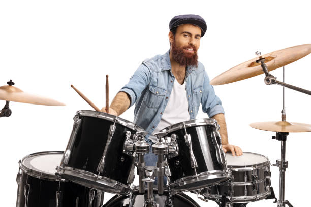 istock Bearded drummer with a drum set smiling at the camera 1201649312