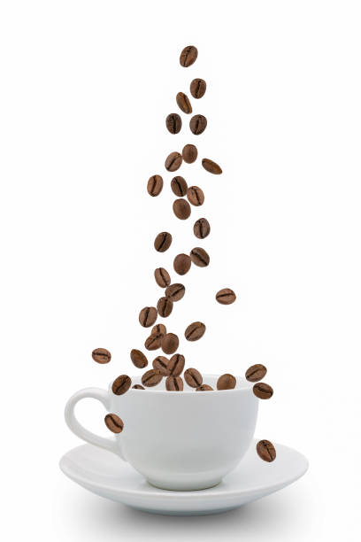 istock Roasted coffee beans falling into coffee cup on saucer with white background,fresh and bright wallpaper concept. 1201650718