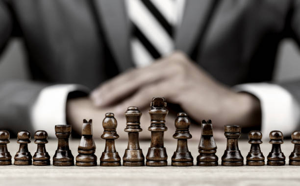 Businessman Playing Chess Board Game For Development Analysis New Strategy  Planningthe Battle Of Competition And Strategy Ideas With Market Mechanism  Stock Photo - Download Image Now - iStock