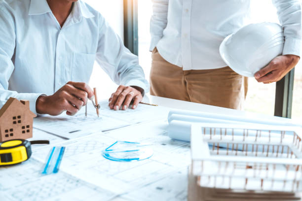 istock Team Engineer drawing graphic planning and meeting for architectural project on workplace 1201651048