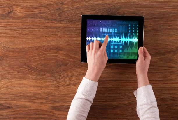 istock Hand holding tablet with sound design concept 1201653370