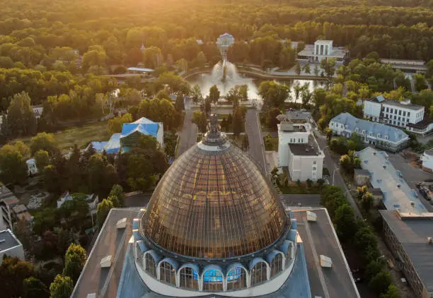 Aerial photography, transparent roof of the pavilion and a golden fountain in the background