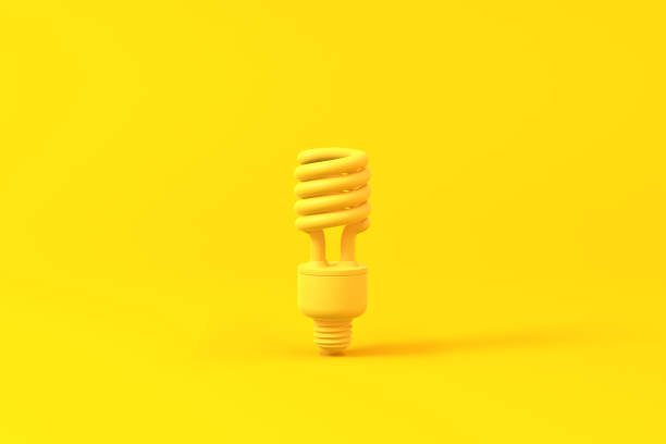 istock Light bulb isolated over a yellow background. Minimalist concept. 1201653565