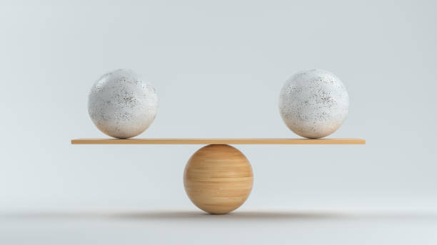 istock wooden scale balancing two big balls - 3D rendered illustration 1201653878