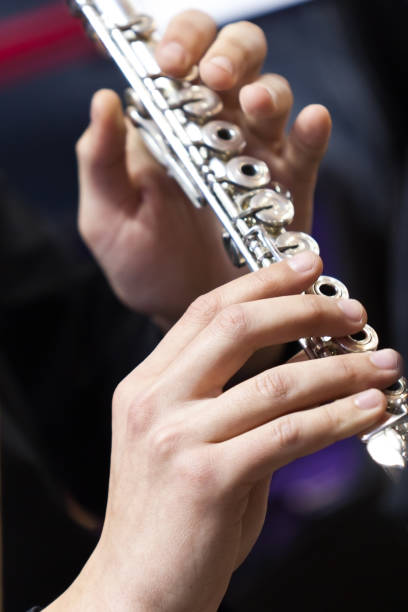 istock Hands of a musician playing flute 1201654987