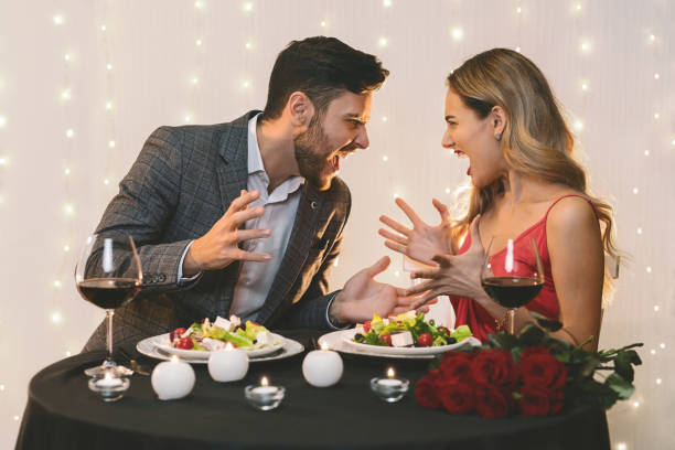 istock Angry couple arguing during romantic dinner in restaurant 1201655290