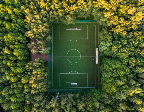Top view of a soccer field in the forest