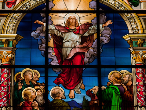 Stained glass window depicting Jesus Christ's resurrection at Easter.