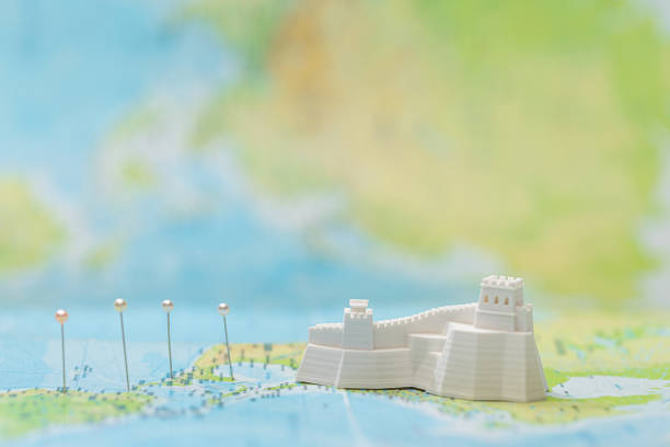 istock small figurine with great wall near pins on map 1201655735