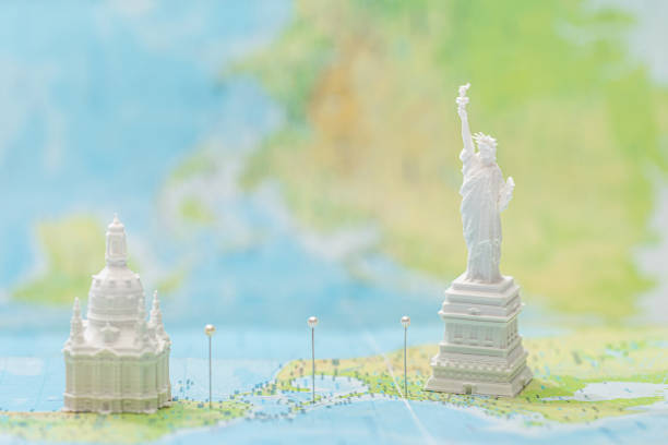 istock small statue of liberty near saint mark`s basilica on map with pins 1201655748