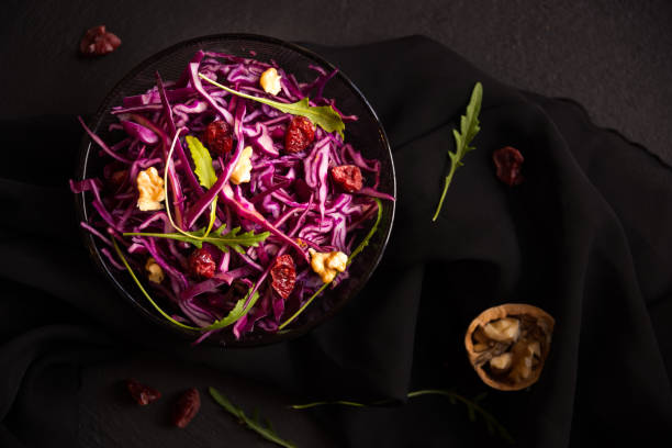 istock Delicious red cabbage salad. Cut red cabbage with other ingredients 1201656510