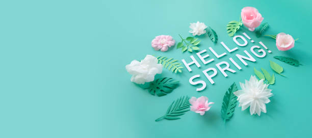 istock Hello, spring With white and rose paper flowers 1201656518