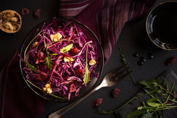 istock Delicious red cabbage salad. Cut red cabbage with other ingredients 1201656697
