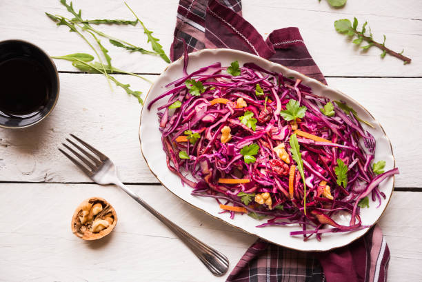 istock Delicious red cabbage salad. Cut red cabbage with other ingredients 1201656714