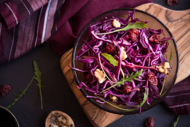 istock Delicious red cabbage salad. Cut red cabbage with other ingredients 1201656891