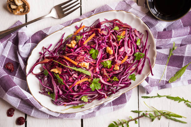 istock Delicious red cabbage salad. Cut red cabbage with other ingredients 1201656924