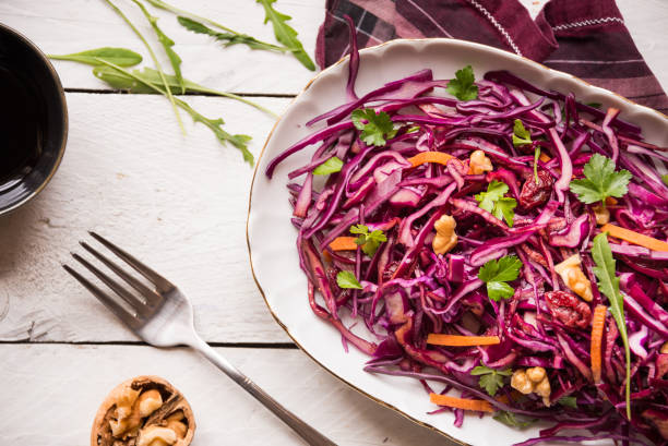 istock Delicious red cabbage salad. Cut red cabbage with other ingredients 1201656934