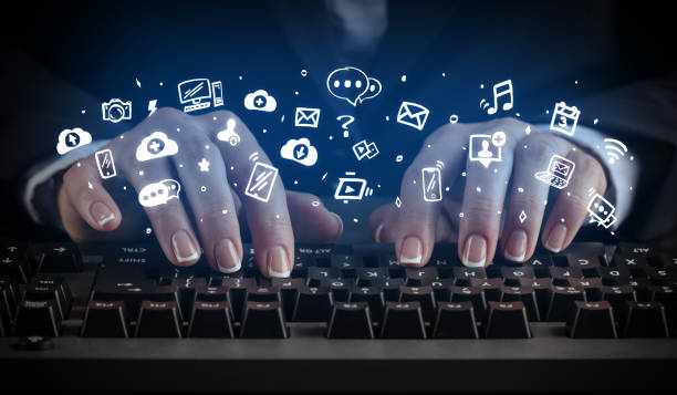 istock Woman typing on keyboard with application icons around 1201657117
