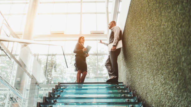 istock A business talk on an office ladder 1201660815