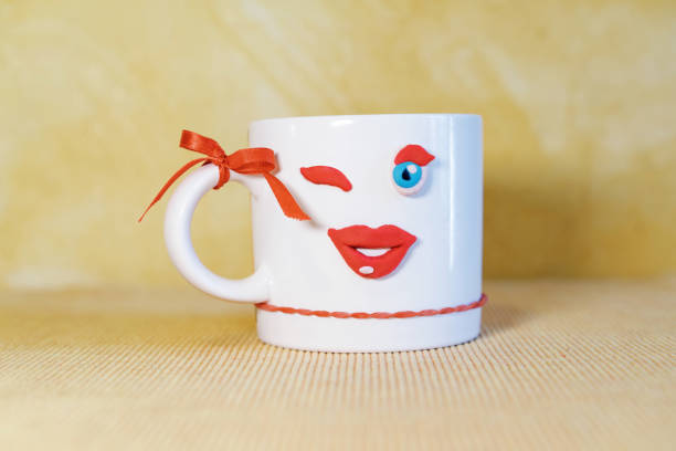 istock mug of coffee funny face 1201663173