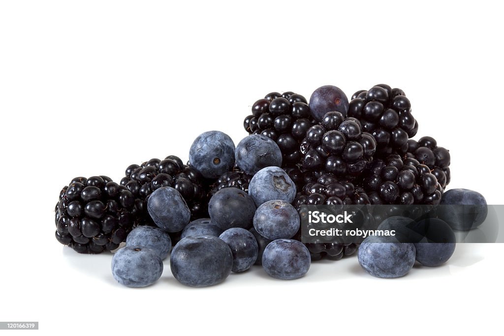 Blackberries and blueberries on white background Blackberries and blueberries, isolated on white background.  Fresh berry fruit goodness.  More fruits and vegetables: Blackberry - Fruit Stock Photo