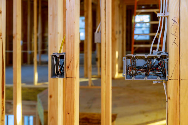 istock Electrical socket boxes with wires of wooden beams in a wall 1201664563
