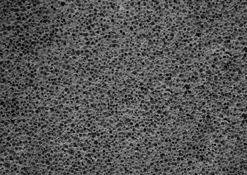 Gray pumice stone texture close up. Porous pumice background.