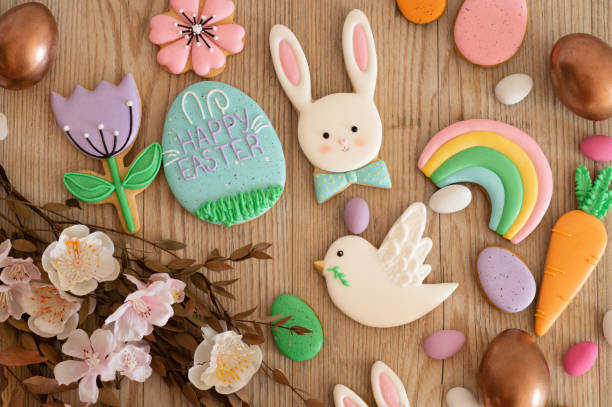 istock Happy Easter. Multicolored pastel easter cookies in a wicker basket  on a wood background 1201666569