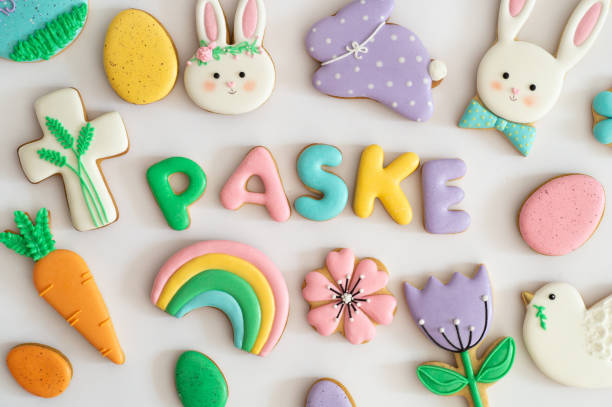 istock Happy Easter. Multicolored pastel easter cookies in a wicker basket  on a wood background 1201666716