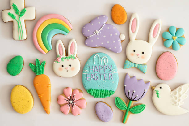 istock Happy Easter. Multicolored pastel easter cookies in a wicker basket  on a wood background 1201666761