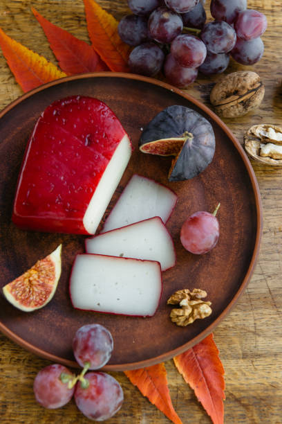 istock Handmade sliced gouda cheese in herbs and figs 1201667336