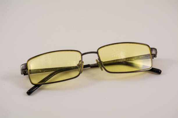 istock Glasses with yellow lenses on a light background 1201668516
