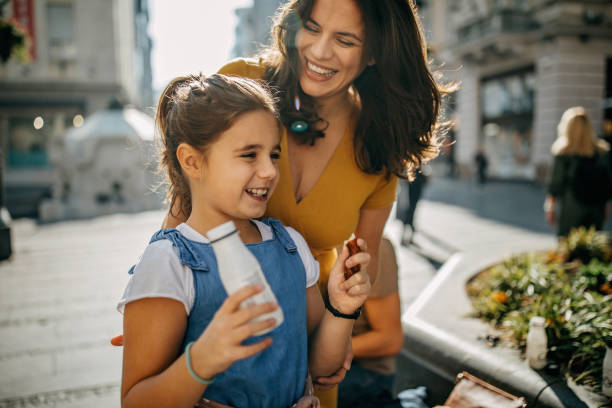istock Mother daughter eating outdoor 1201668945