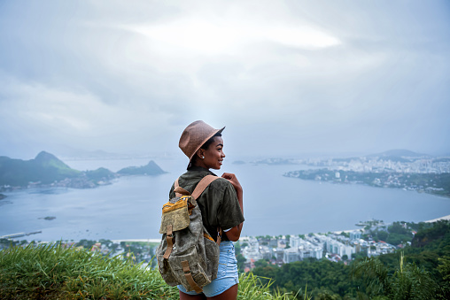 Portrait of young afro woman explorer