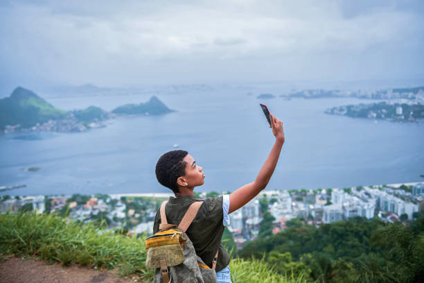 istock Woman Using Smart Phone in Nature 1201670052