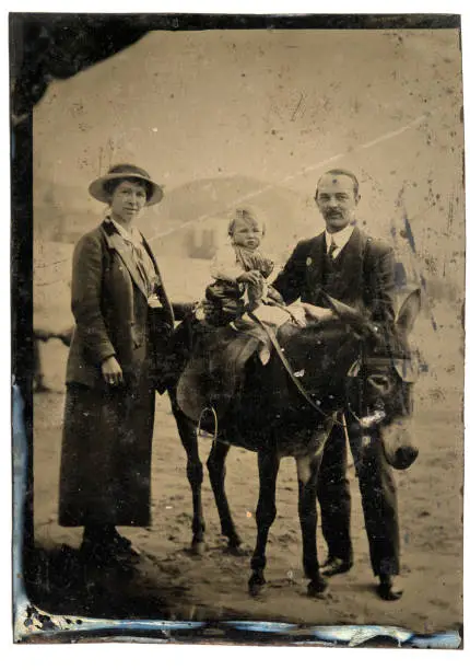 Photo of Antique tintype photograph, Family at seaside, Child riding donkey, beach