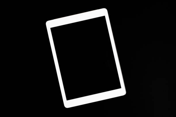 istock white tablet turned off on a black background. minimal black white concept. space for text 1201670739