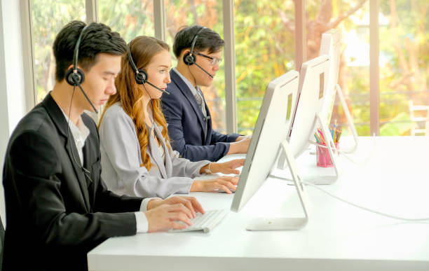 istock Young man work as operator for the business and also work with the other co-workers during day time 1201672516
