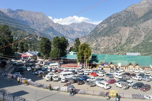 Top view of Ramleela Ground Parking lot at an altitude of 2670 m, surrounded by panoramic Kinner Kailash mountain range. Reckong Peo, Himachal Pradesh, City Kinnaur, India South Asia Pac December 2019