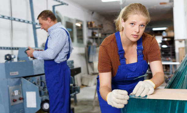 istock Woman working in glass workshop 1201674387