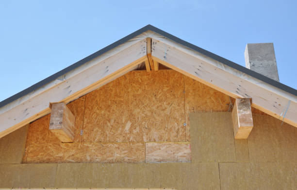 istock Attic insulation outdoor. Rooftop house attic insulation with rock wool. 1201674708