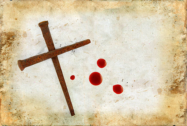 Cross of Rusty Nails and Blood Drops on Grunge Rusty Nails Forming a Cross and drops of blood on a grunge background. rusty barb stock pictures, royalty-free photos & images