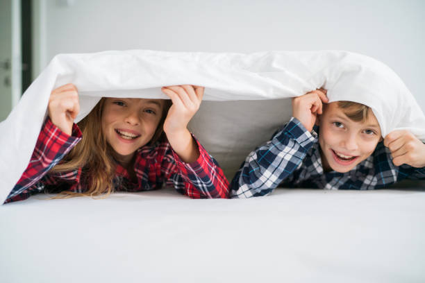 istock Children in pajamas in bed 1201676022