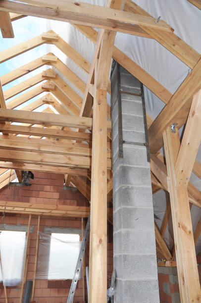 istock Building pumice chimney inside attic.  House roofing construction. 1201676620