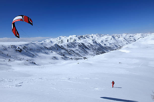 istock man with a kite on the snow 120167973
