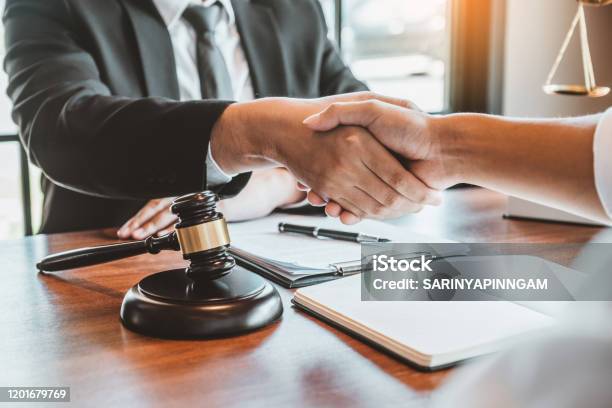 Businessman Shaking Hands To Seal A Deal Judges Male Lawyers Consultation Legal Services Consulting In Regard To The Various Contracts To Plan The Case In Court Stock Photo - Download Image Now