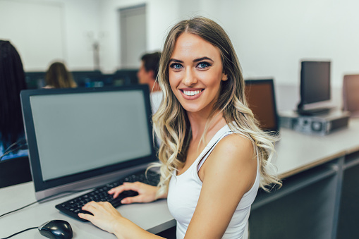 smiling businesswoman in office looking at camera