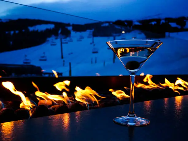 Photo of Apres Ski with a fire and a drink, in front of the slopes