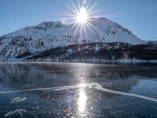 istock Frozen lake and snowcapped mountain in Switzerland 1201683439